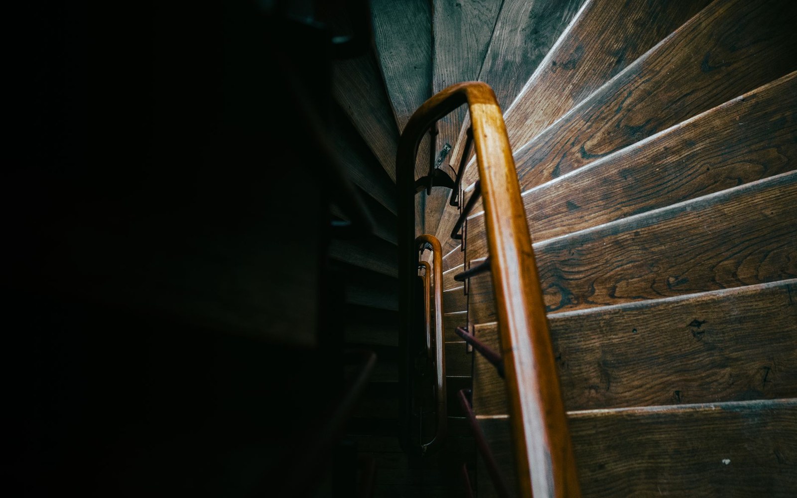 The interior staircase of the restaurant Drouant on place Gaillon, Paris, its wrought-iron balustrade and pale stone steps lit from above